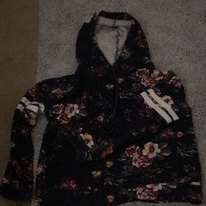 A floral hoodie with white stripes